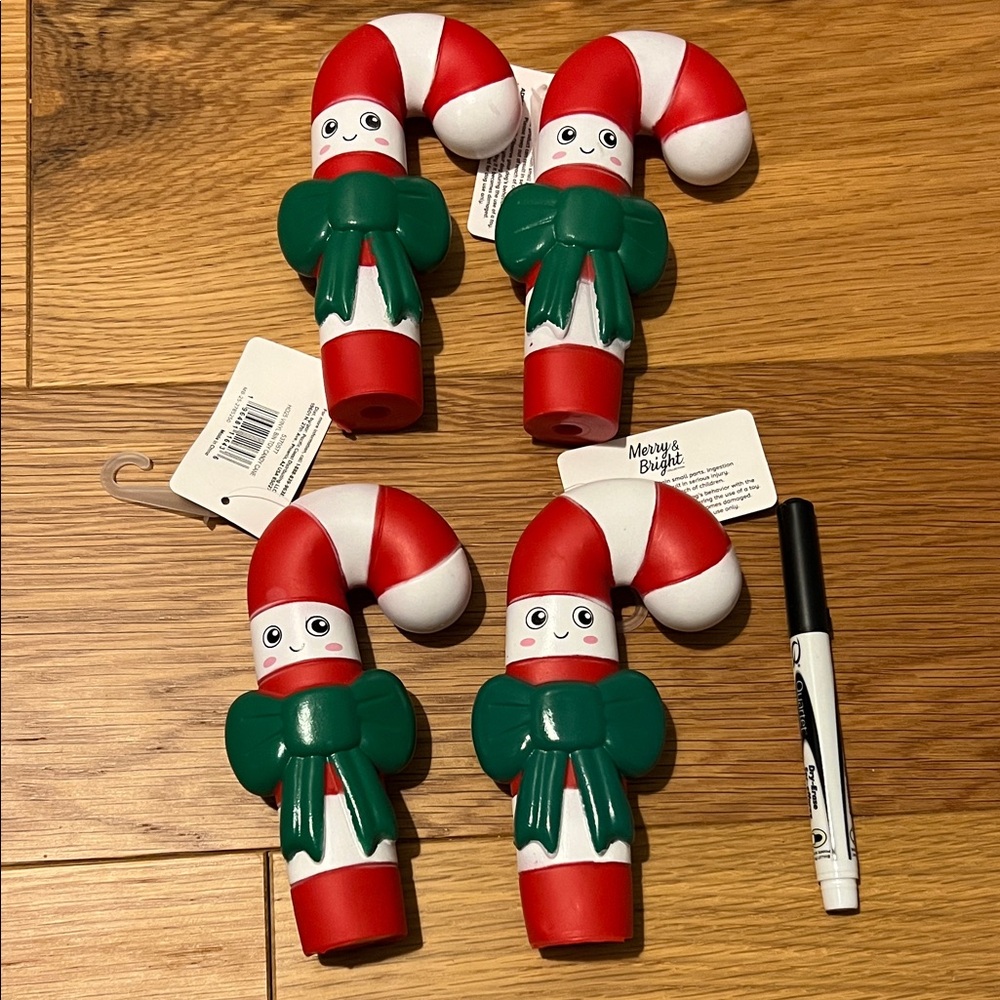 Set of four candy cane dog squeaker toys